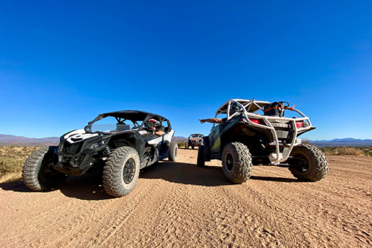 atv and utv photographed in the dirt